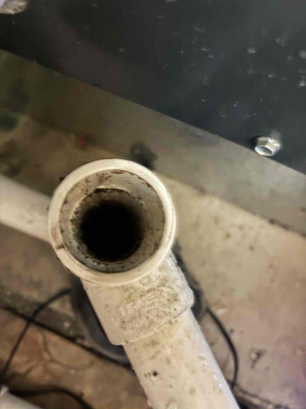 Completed platinum level planned maintenance on a single 4-year-old HVAC system. Performed comprehensive system inspection and replaced 20x20x5 monthly filter. Verified condensate drain line condition and documented proper drainage flow from PVC discharge pipe. Measured and recorded system electrical parameters using clamp meter, confirming amperage draw of 2.0 amps and temperature reading of 43.4 degrees, both within normal operating specifications for the unit.