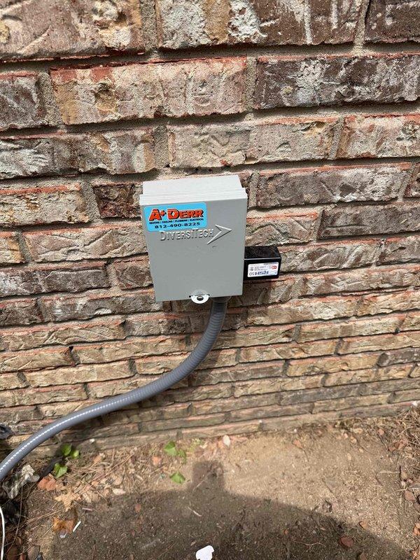 # HVAC Install - Complete System

Successfully completed installation of a 3-ton, 19 SEER heat pump system with matching air handler for residential application in Newburgh. The outdoor heat pump unit was installed on an exterior brick wall with proper electrical disconnect box mounted for service accessibility. Gray weatherproof electrical conduit was routed from the disconnect to the condensing unit following code requirements.

The indoor air handler was wall-mounted in the garage space, featuring reflective insulated ductwork connections at the supply plenum. All electrical connections were completed with appropriate flexible conduit, and manufacturer labels remain visible for future service reference. The installation includes proper clearances for maintenance access and adequate support for the air handling equipment.

System was installed per manufacturer specifications with service financing arranged through the sales department. All components are properly secured, electrical 