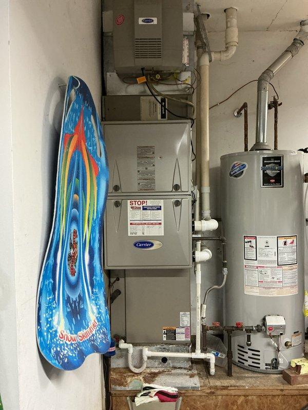 Completed planned maintenance visit on 12-year-old single-system residential HVAC installation consisting of Carrier furnace with integrated humidifier and matching outdoor condensing unit. Performed comprehensive system inspection including visual assessment of indoor equipment installation, ductwork connections, and exterior condenser unit condition. All equipment operational with no immediate service concerns identified during this second follow-up maintenance visit.