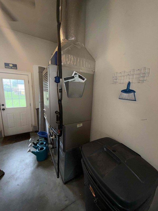 Responded to no-cooling complaint on 15-year-old residential HVAC system with outdoor unit completely frozen and continuous runtime. Upon arrival, confirmed ice buildup on evaporator coil and indoor unit components. System was allowed adequate thaw time prior to diagnostic evaluation. Inspected indoor air handler, ductwork connections, and refrigerant lines for restrictions, leaks, and airflow issues. Observed rust deterioration on internal components and mounting hardware indicating age-related wear. Evaluated blower operation, filter condition, and return air pathways. Assessed refrigerant circuit for potential low charge or restriction causing freeze condition. Documented system condition with measurements and photographic evidence of internal components and overall installation.