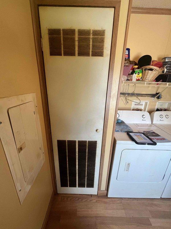Conducted comprehensive HVAC replacement estimate for non-functional residential system. Evaluated existing equipment configuration in utility room, assessed electrical panel capacity and circuit availability for new system installation, and documented current HVAC cabinet with louvered ventilation access points. Provided homeowner with complete replacement options and specifications for new heating and cooling system installation.