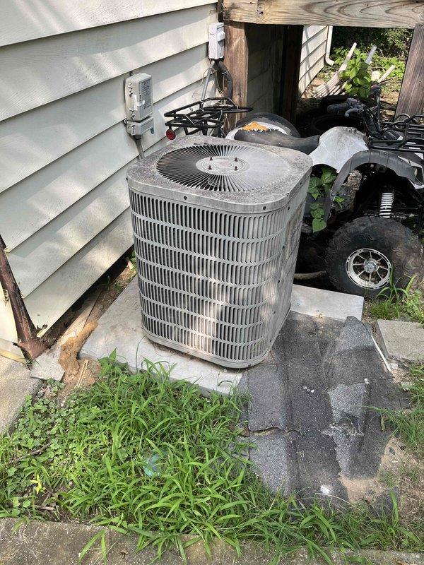 Completed full HVAC system replacement estimate for 15+ year old residential cooling system that had failed. Assessed existing gas furnace installation in basement with metallic ductwork configuration and outdoor cylindrical air conditioning condenser unit showing significant age-related wear and weathering. Provided comprehensive replacement-only options for complete system upgrade to restore cooling functionality to the property.