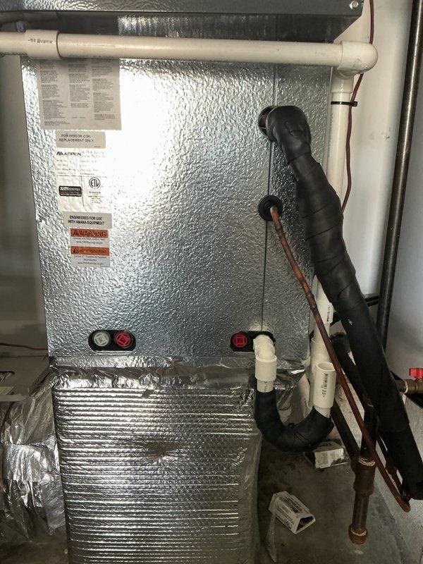 # No Cooling - Evaporator Coil Failure

Responded to no cooling complaint on 5-year-old residential HVAC system. Upon arrival, verified system was not producing cool air. Reviewed service history indicating another contractor recently added refrigerant due to low charge. 

Performed comprehensive system diagnostics using refrigerant manifold gauges and pressure testing equipment. Inspected indoor air handler unit and refrigerant line set for leaks and abnormalities. Conducted pressure tests on refrigerant circuit to identify source of refrigerant loss.

Testing revealed evaporator coil failure as primary cause of refrigerant leak and subsequent loss of cooling capacity. Coil exhibited leak that could not be repaired and required complete replacement. Documented coil model and serial number information from air handler nameplate data for warranty parts ordering.

Photographed failed evaporator coil assembly and air handler unit specifications to support warranty claim submission. Captur