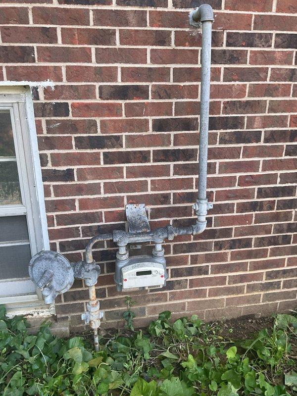 Completed comprehensive HVAC replacement estimate for residential property with existing gas furnace and air conditioning system located in mechanical closet. Evaluated current equipment condition, ductwork configuration, gas line accessibility, and exterior condensing unit placement to provide complete system replacement recommendations for both heating and cooling components.