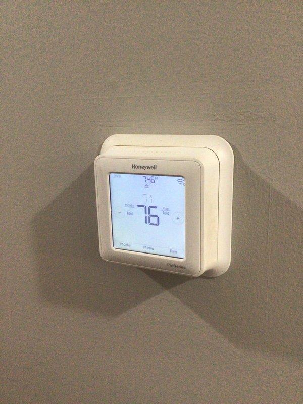Completed comprehensive preventative maintenance tune-up on residential air conditioning system. Performed thorough inspection of outdoor condenser unit and indoor thermostat system. System operating within normal parameters with no deficiencies noted. All components tested and verified functional. Thermostat displaying proper temperature readings and responding correctly to input commands.