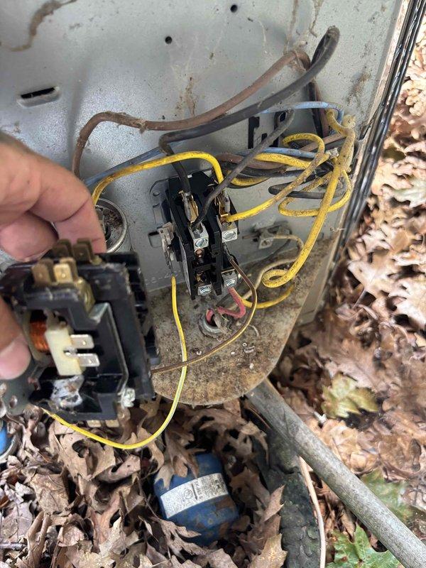 Responded to no-power condition on downstairs cooling unit. Upon arrival, confirmed system was completely inoperative with no fan operation. Diagnosed failed contactor preventing compressor and condenser fan operation. Replaced defective contactor with new component, verified proper voltage at 242V, and tested system operation. Unit restored to normal cooling function with all components operating within specifications.