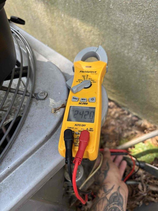 Responded to no-power condition on downstairs cooling unit. Upon arrival, confirmed system was completely inoperative with no fan operation. Diagnosed failed contactor preventing compressor and condenser fan operation. Replaced defective contactor with new component, verified proper voltage at 242V, and tested system operation. Unit restored to normal cooling function with all components operating within specifications.
