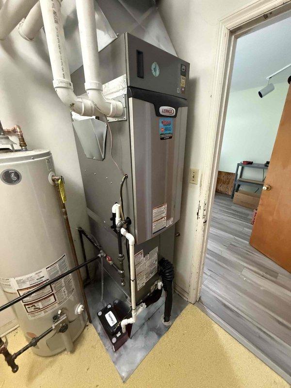 Completed full HVAC system installation featuring a 3-ton Lennox 17 SEER two-stage air conditioning unit paired with a 97% AFUE two-stage downflow gas furnace in the interior mechanical room. Installed outdoor condensing unit with proper refrigerant charging and pressure testing, verified system operation using digital manifold gauges showing optimal temperature and pressure readings. Delivered four 4x10x6 floor supply grills to complete the ductwork distribution system for proper airflow throughout the residence.