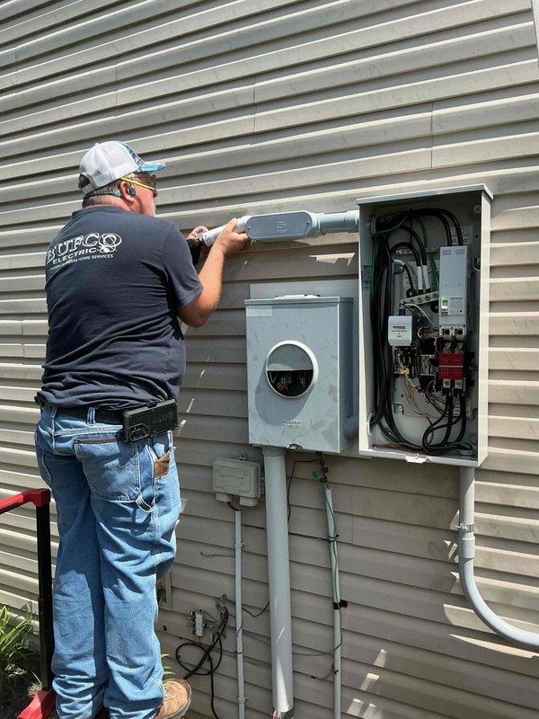 Completed installation of electrical transfer switch system under permit 20261788. Installed new meter socket panel and transfer switch panel on exterior wall with proper conduit runs and weatherhead connections. Wired internal transfer switch components including circuit breakers, control relays, and associated branch circuits with appropriate color-coded conductors and proper terminations. All electrical connections were secured, panels were properly grounded, and installation was completed in accordance with NEC requirements and local code specifications.