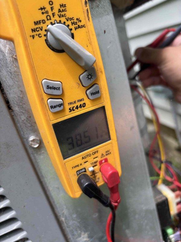 Completed routine planned maintenance on residential air conditioning system installed in 2020. Performed comprehensive AC tune-up including electrical diagnostics, measuring voltage at 385V using calibrated multimeter to verify proper power supply to system components. Inspected evaporator coil assembly, noting significant oxidation and patina on copper tubing consistent with system age and normal moisture exposure. Observed dust and debris accumulation on aluminum cooling fins. Verified refrigerant line connections and brass valve fittings for proper sealing. Checked condensate drain system including PVC piping for proper drainage. All electrical connections tested and found operational. System operating within normal parameters upon completion of maintenance service.