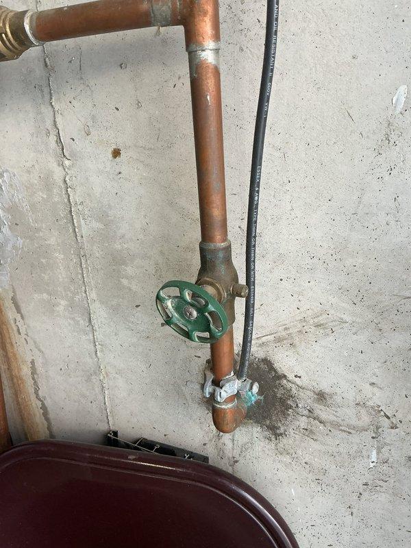 # Plumbing Maintenance - Tanked Water Heater Flush - A+

Performed routine maintenance flush on Bradford White tanked water heater system. Drained sediment and mineral buildup from tank bottom through drain valve to restore heating efficiency and extend equipment lifespan. Inspected all plumbing connections, copper supply lines, isolation valves, and expansion tank mounted above unit. Verified proper operation of green wheel-style shutoff valve and secondary valve controls. System refilled, tested for leaks, and confirmed proper pressure levels throughout hot water distribution system.