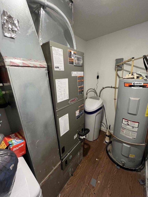 Completed installation of a 3-ton Lennox 15.2 SEER heat pump system with matching air handler. The outdoor heat pump unit was positioned on a concrete pad with refrigerant lines and electrical conduit properly secured to the exterior wall, while the indoor air handler was installed in the utility room with appropriate ductwork connections. System was tested and confirmed operational upon completion.