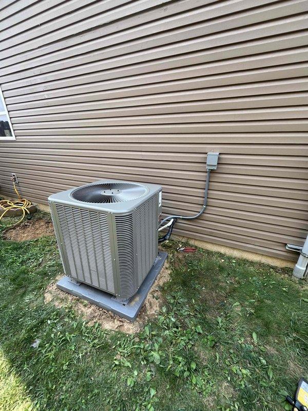 Completed installation of a 3-ton Lennox 15.2 SEER heat pump system with matching air handler. The outdoor heat pump unit was positioned on a concrete pad with refrigerant lines and electrical conduit properly secured to the exterior wall, while the indoor air handler was installed in the utility room with appropriate ductwork connections. System was tested and confirmed operational upon completion.