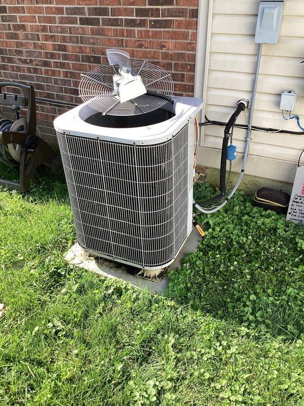 Responded to no cooling complaint on 15-year-old Carrier heat pump system. Unit running but failing to adequately cool the home with no visible ice formation at indoor coil. Performed system diagnostics and identified failed evaporator coil and thermostatic expansion valve requiring replacement. Ordered slant coil and TXV for follow-up installation. System remains operational but with reduced cooling capacity until parts arrive and replacement is completed.
