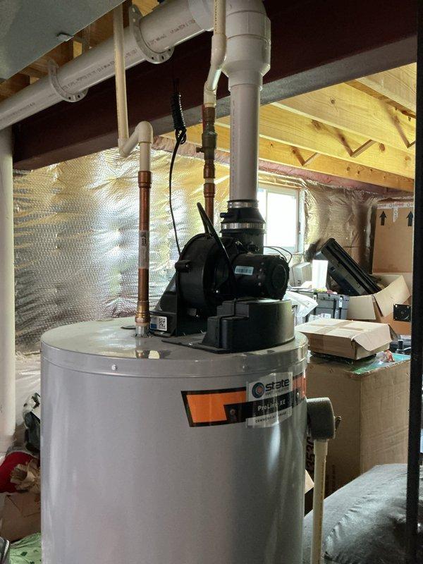 # Plumbing Maintenance - Tanked Water Heater Flush

Performed comprehensive maintenance service on residential tanked water heater system located in attic space. Executed complete tank flush procedure to remove sediment buildup and mineral deposits from the bottom of the water heater tank, which is essential for maintaining heating efficiency and extending equipment lifespan.

The service included shutting off the water supply and power to the unit, connecting a discharge hose to the drain valve, and systematically flushing the tank until water ran clear of sediment and debris. Collected discharge water in appropriate containers and inspected sediment levels to assess tank condition. The flush revealed moderate sediment accumulation, which is typical for units operating in areas with hard water or mineral-rich water supply.

Following the flush procedure, inspected all plumbing connections including the copper supply lines with foam insulation, white PVC vent piping, and the circulatio