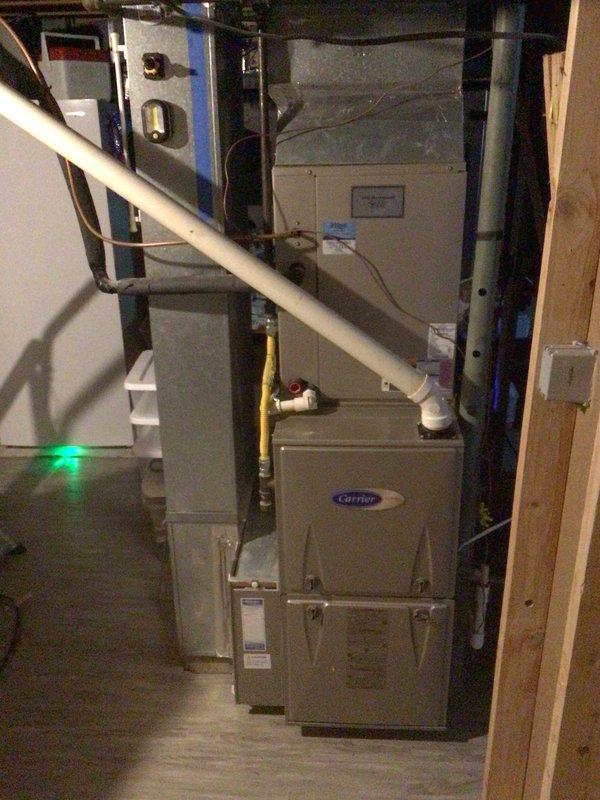 Completed scheduled preventive maintenance on residential Carrier split system HVAC equipment. Performed comprehensive AC tune-up including inspection of indoor furnace unit located in basement and outdoor condensing unit positioned on covered patio. Verified proper operation of all system components, checked refrigerant lines, inspected condensate drainage system, and confirmed equipment is functioning within manufacturer specifications. No issues identified during inspection. System operational and ready for continued service.