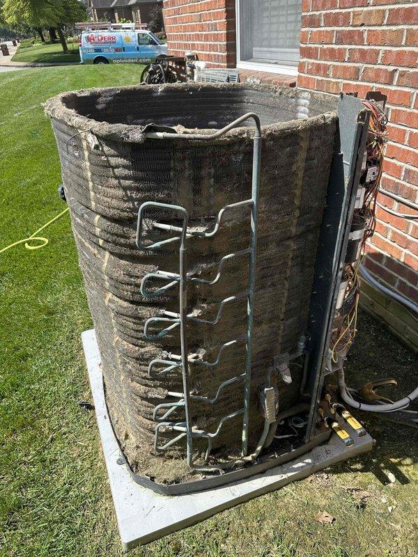 Responded to no-cool complaint on 5-year-old upstairs system unable to maintain setpoint below 79°F with high humidity. Upon arrival, inspected outdoor condensing unit and found extensive external contamination with heavy dirt and debris accumulation on condenser coil fins, significantly restricting airflow and reducing heat transfer efficiency. Unit exterior showed severe weathering and deterioration of protective casing. System has documented history of refrigerant loss indicating potential leak in refrigerant circuit. Due to extreme coil fouling and suspected refrigerant leak, recommended scheduling return visit for comprehensive leak search and system evaluation. Customer advised that service must be scheduled after 9 AM due to availability constraints. Secondary cooling system operational on first floor providing temporary relief.
