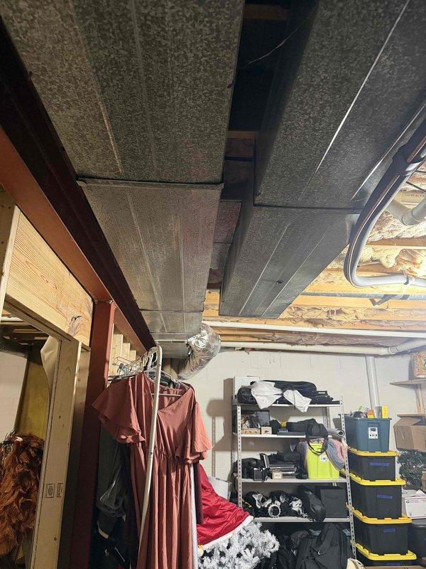 Responded to callback for insufficient cooling and reduced airflow following initial service visit. Upon arrival, found indoor temperature at 82°F with thermostat set to 77°F and system running continuously without achieving setpoint. Inspected Lennox air handler unit located in basement utility area and evaluated ductwork system throughout unfinished basement space. Verified reduced airflow at supply registers and investigated potential restrictions in duct system, including flexible duct runs and acoustic ceiling plenum areas. Assessed filter condition, blower operation, and refrigerant circuit performance to identify root cause of continued cooling deficiency and compromised air delivery.