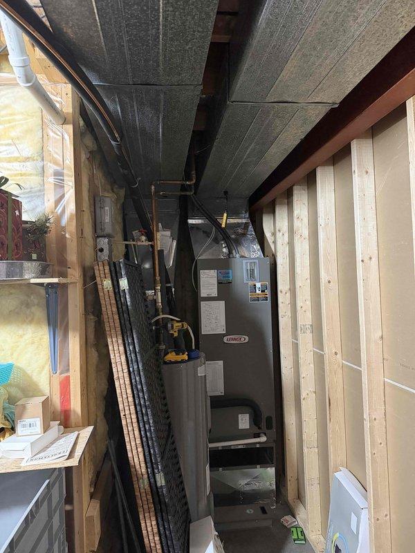 Responded to callback for insufficient cooling and reduced airflow following initial service visit. Upon arrival, found indoor temperature at 82°F with thermostat set to 77°F and system running continuously without achieving setpoint. Inspected Lennox air handler unit located in basement utility area and evaluated ductwork system throughout unfinished basement space. Verified reduced airflow at supply registers and investigated potential restrictions in duct system, including flexible duct runs and acoustic ceiling plenum areas. Assessed filter condition, blower operation, and refrigerant circuit performance to identify root cause of continued cooling deficiency and compromised air delivery.