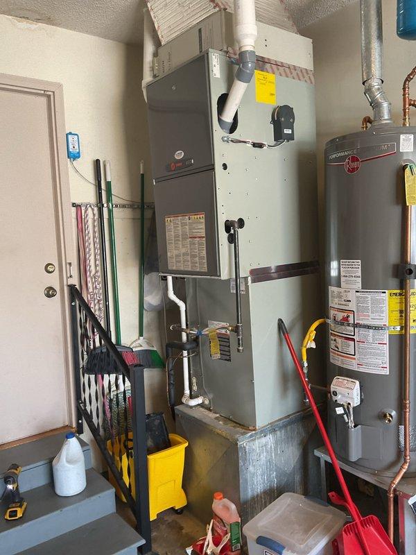 Responded to water leak complaint on indoor HVAC unit located in garage. Upon arrival, inspected furnace and associated condensate drainage system for source of water accumulation. Identified issue with condensate line, cleared blockage, and verified proper drainage flow. Tested system operation to confirm leak was resolved and no further water discharge occurring from unit enclosure.