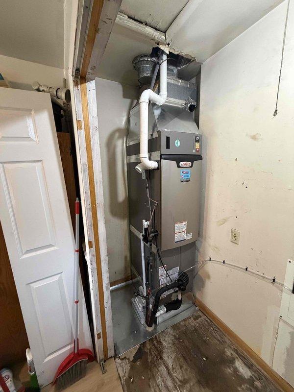 Completed full HVAC system installation of a 2-ton, 18 SEER/97% AFUE unit in residential mechanical closet. Installed new air handler with proper PVC condensate drainage and venting through ceiling penetration, secured all refrigerant lines and electrical connections per manufacturer specifications. Performed system startup, refrigerant charge verification using manifold gauges with micron readings confirming proper evacuation and system tightness, and conducted full operational testing to ensure heating and cooling functions meet design parameters.