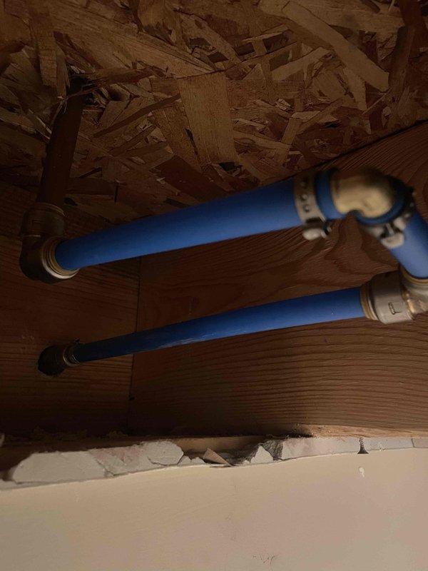 Upon arrival, identified a hose bib mounted on exterior brick wall with minor leakage at wall penetration point and evidence of previous water intrusion. Assessed interior access point and determined repair would require cutting into basement ceiling drywall, which was outside scope of work. Secured hose bib fixture directly to brick wall using anchoring hardware and applied silicone sealant around entire perimeter of wall penetration to prevent water infiltration and seal against environmental elements.