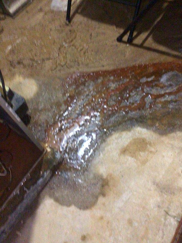 Completed monthly Gold Level planned maintenance on 11-year-old single system. Discovered active water leak at air handler with significant pooling on floor and rust-colored staining indicating ongoing moisture intrusion. Inspected internal components and found substantial mineral scale buildup on drain pan and base surfaces, confirming chronic condensate drainage issue. Replaced 16x25x5 filter per maintenance protocol. Identified compromised drain system requiring immediate attention to prevent further water damage and potential electrical hazards to control board and relay components.