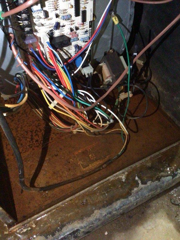 Completed monthly Gold Level planned maintenance on 11-year-old single system. Discovered active water leak at air handler with significant pooling on floor and rust-colored staining indicating ongoing moisture intrusion. Inspected internal components and found substantial mineral scale buildup on drain pan and base surfaces, confirming chronic condensate drainage issue. Replaced 16x25x5 filter per maintenance protocol. Identified compromised drain system requiring immediate attention to prevent further water damage and potential electrical hazards to control board and relay components.