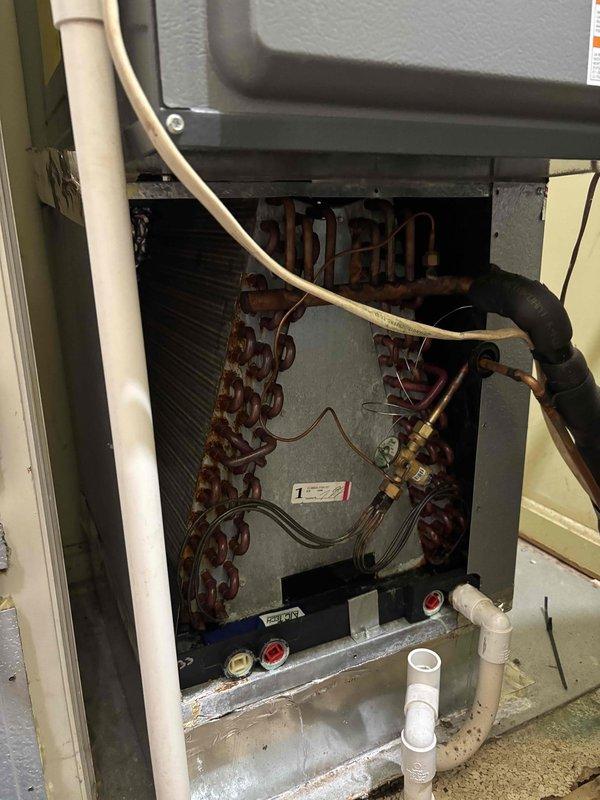 # HVAC Maintenance Report

Completed Platinum Level maintenance on a 7-year-old residential HVAC system including replacement of 16x25x5 air filter, comprehensive system diagnostics with multimeter readings confirming proper electrical operation at 4079 units, and thorough inspection of evaporator coil assembly which revealed significant rust and corrosion on copper tubing and coil surfaces indicating advanced age and moisture exposure. All refrigerant lines, condensate drain system with PVC drainage, and air handler components were visually inspected and documented photographically for customer records.
