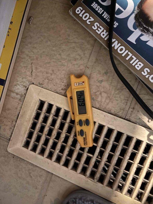 Responded to a free second opinion request for an air conditioning system that has not been keeping up with cooling demands. Accessed the crawl space to inspect the HVAC system installation and measured supply air temperature and airflow at floor registers using diagnostic equipment. Found the property had only received previous boiler service with no prior AC maintenance history, requiring a comprehensive system evaluation to determine why the cooling system was underperforming.