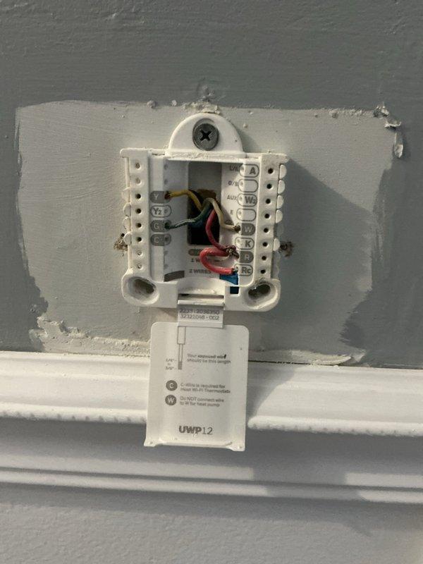 Conducted comprehensive on-site evaluation for complete HVAC system replacement. Documented existing equipment including outdoor condensing unit and indoor thermostat/control system. Photographed current system configuration, wiring connections at thermostat terminal blocks, and exterior unit specifications including model numbers, serial numbers, and electrical ratings. Provided customer with detailed replacement estimate for new high-efficiency system upgrade.