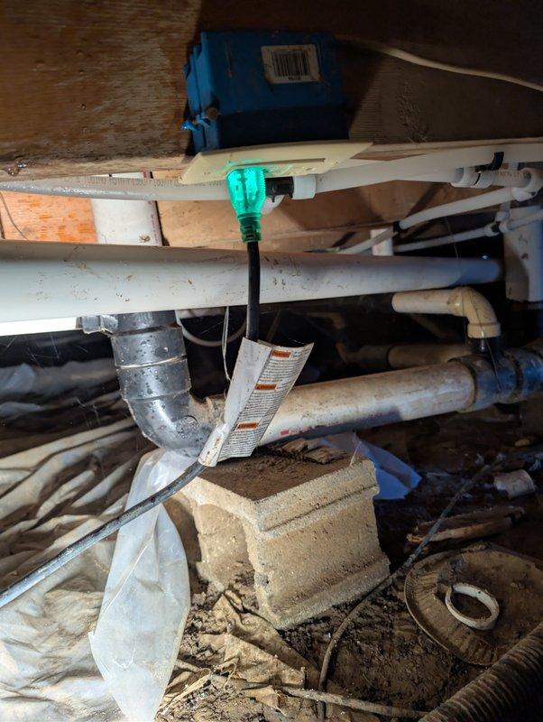 Responded to customer concern regarding inaudible sump pump operation. Performed on-site inspection of sump pump system, accessing crawl space to evaluate pump assembly, float mechanism, and associated components. Documented existing conditions showing significant corrosion on pump housing and mechanical components, with pump basin exhibiting heavy weathering and deterioration. Verified float operation and assessed overall system functionality to determine if pump was operating within normal parameters.