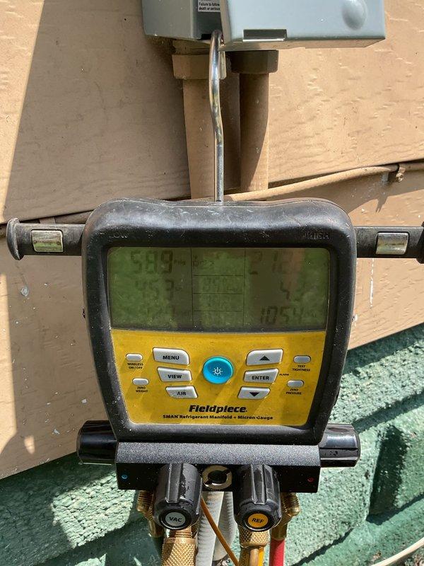 Completed monthly Gold Level planned maintenance on single 8-year-old residential HVAC system. Performed comprehensive system inspection including condenser unit examination with top panel removed to assess compressor, refrigerant lines, and condenser coil condition. Utilized Fieldpiece digital manifold gauge to verify system pressures and temperatures, recording operational readings to ensure proper refrigerant charge and system performance. Observed normal wear consistent with system age, including minor debris accumulation on condenser coil and slight fin compression. All components functioning within acceptable parameters at time of inspection.