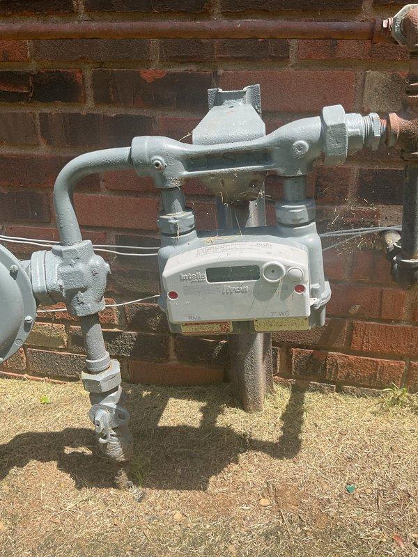Conducted comprehensive electrical estimate for whole-house natural gas generator installation at residential property. Evaluated existing 200-amp electrical service panel with adequate breaker capacity for generator integration and documented natural gas meter assembly with Itron digital display and existing gas line infrastructure for fuel supply connection. Assessment confirmed compatibility of current electrical distribution system and natural gas service for proposed automatic standby generator system with required transfer switch installation.
