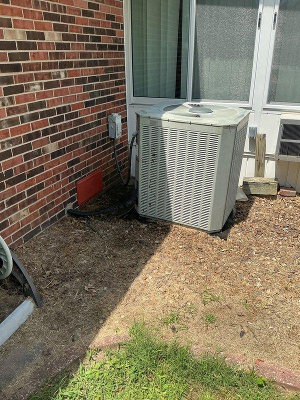 Responded to no cooling complaint on 30+ year old residential air conditioning system. Upon arrival, confirmed unit was operational but producing only warm air with reduced airflow through vents. Conducted comprehensive system diagnostic on outdoor condenser unit and indoor air handler. Evaluated compressor operation, refrigerant levels, and airflow characteristics. Performed load calculations showing heating requirement of 40,580 BTUh with 527 CFM airflow and cooling requirement of 26,486 BTUh with 993 CFM airflow. Given the system's age of approximately three decades and current performance issues, documented findings and provided assessment of equipment condition and replacement recommendations to restore proper cooling function.
