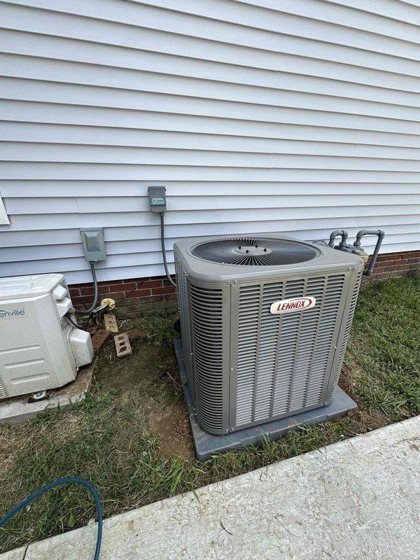 # HVAC Install - Complete System

Successfully completed full residential HVAC system installation featuring a 3-ton Lennox two-stage air conditioning unit with 17 SEER efficiency rating paired with a two-stage 97% AFUE downflow gas furnace. 

Installed outdoor condenser unit on concrete pad against exterior wall with proper clearances maintained for optimal airflow and serviceability. Mounted electrical disconnect box on exterior wall and ran refrigerant line set through wall penetration, securing lines vertically along siding with appropriate hangers and protection. Connected refrigerant lines to condenser unit and completed all electrical connections per manufacturer specifications and local code requirements.

Positioned downflow furnace in attic alcove on concrete platform, ensuring proper clearances for combustion air and venting. Installed complete venting system for high-efficiency furnace exhaust and intake. Connected copper refrigerant lines from outdoor unit to indoor coil. 