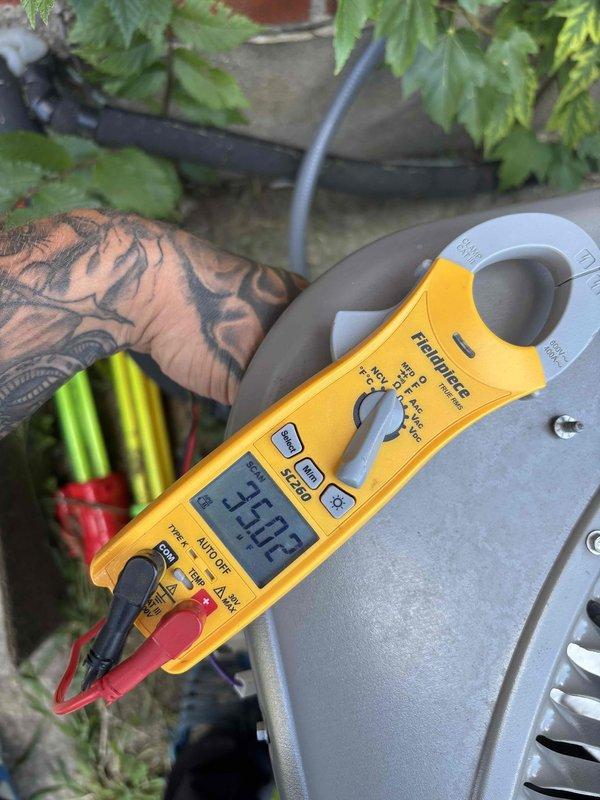Completed planned maintenance visit on outdoor HVAC unit after previous dismissal due to tenant access restrictions. Performed electrical system inspection, verified component connections and relay operation, and measured system amperage at 33.02A indicating normal operating parameters. Unit operating within manufacturer specifications with all electrical connections secure and properly grounded.