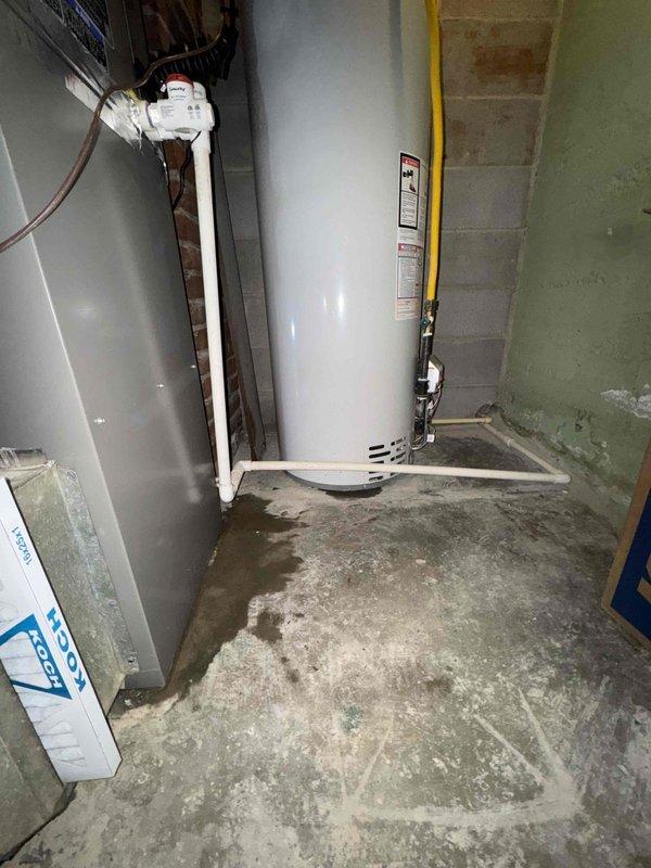 Completed full HVAC system installation in residential mechanical closet, including new Lennox furnace unit with associated gas line, venting, and ductwork connections. Installation included proper routing of yellow-jacketed gas supply line, white PVC condensate drainage and venting system, flexible aluminum ductwork, and electrical conduit within confined utility space featuring exposed brick wall construction. All components secured with appropriate mounting brackets and fittings, ensuring code-compliant integration with existing water heater and utility infrastructure in basement mechanical room.