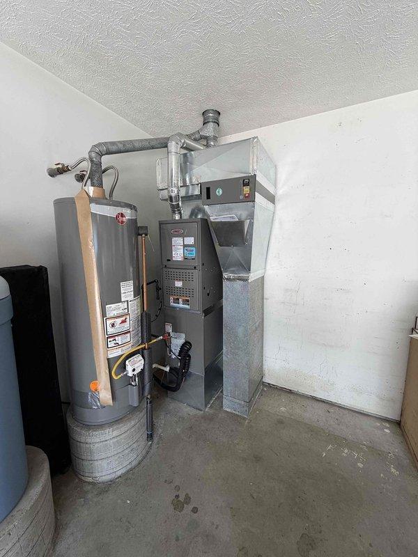 # HVAC System Installation

Successfully completed the installation of a 3-ton Lennox 15.2 SEER2 80% AFUE downflow gas furnace system in the basement utility area. The new furnace was positioned adjacent to the existing water heater, with proper clearances maintained for safety and serviceability. 

Installed flexible aluminum ductwork connecting the furnace to the existing distribution system, forming a proper T-junction configuration at the ceiling plenum. All duct connections were properly sealed and secured to ensure efficient airflow and prevent air leakage. The furnace control panel was mounted and wired according to manufacturer specifications.

Connected gas supply line to the furnace using appropriate materials and methods, ensuring all connections meet code requirements. Verified proper combustion air supply and venting arrangements for safe operation of the heating equipment. All electrical connections were completed with proper wire sizing and overcurrent protection.

Syste