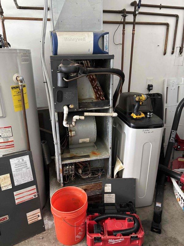 # HVAC Maintenance Summary

Completed annual Gold Level planned maintenance visit on a 5-year-old residential HVAC system. Performed comprehensive inspection of outdoor condensing unit, including electrical component testing with digital multimeter to verify proper capacitor function and electrical connections. Inspected indoor air handler with integrated Honeywell humidifier system, checking all mechanical components, ductwork connections, and operational controls. All equipment found operating within manufacturer specifications with no deficiencies noted. Documented system condition with photographic records for service history.