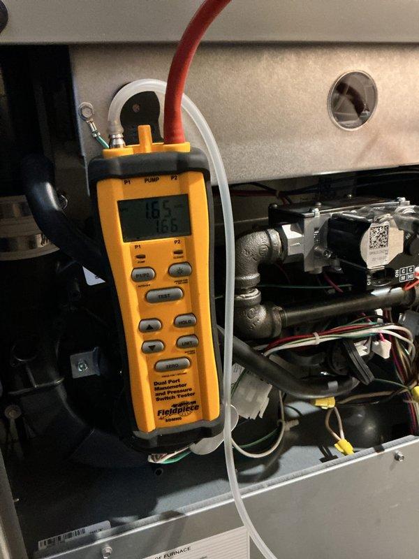 # HVAC Maintenance Summary

Completed annual platinum-level preventative maintenance on a single residential HVAC system with a 16x25 filter size. System age indicates recent installation with expected service date of 3/27/26.

# Work Performed

Performed comprehensive system inspection and diagnostic testing using calibrated manometer equipment. Measured gas pressure at 4.85" water column to verify proper combustion and system operation within manufacturer specifications. Inspected all electrical connections, control board components, and wiring harnesses for signs of wear, damage, or loose connections. Verified proper function of terminal blocks and ensured all wire bundles were properly secured with cable management ties.

Examined furnace interior components including heat exchanger access area, gas valve assembly, and associated piping connections. Checked all tubing connections for leaks and proper seating. Inspected pressure switch operation and tested safety controls for proper