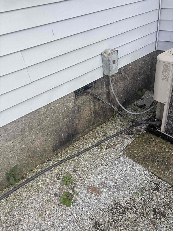 Conducted comprehensive replacement estimate for 22-year-old non-functional HVAC system at residential property. Evaluated existing outdoor unit condition, electrical disconnect configuration, and installation site accessibility including gravel pad area and weathered equipment mounting location. Documented current system setup and site conditions to provide homeowner with complete replacement options, as repair was not desired given equipment age and operational status.