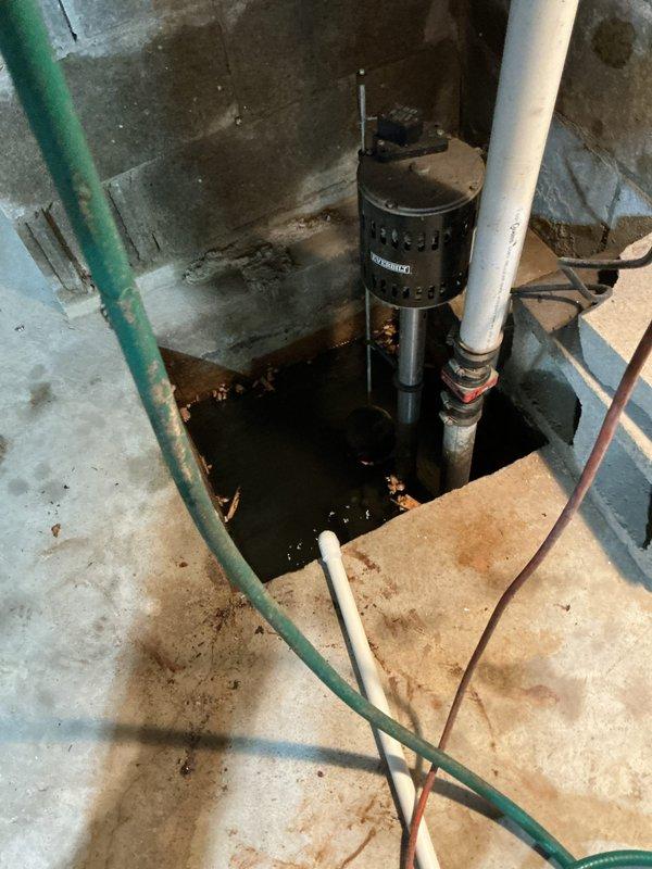 Successfully installed a Navien 240A2 tankless water heater system in the basement utility area, mounted on concrete block wall with proper venting through white PVC exhaust piping. Completed all hot and cold water supply connections using color-coded PEX tubing (red, blue, and yellow lines) with secure fittings to the unit's inlet and outlet ports. Configured digital control panel settings and verified proper operation of the tankless system. Unit is covered by a 5-year heat exchanger warranty and lifetime jacket warranty for the tankless components.