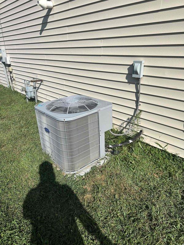 # HVAC Service Completed

Responded to no-cooling call on 15-year-old residential air conditioning system. Customer reported thermostat was calling for cooling but outdoor condensing unit would not start or run. Upon arrival, performed visual inspection of outdoor Carrier condensing unit and indoor air handler system. 

Verified thermostat was properly set to cooling mode and calling for operation. Checked electrical disconnect at outdoor unit and confirmed power supply was available. Tested compressor contactor and found failed contactor preventing compressor and condenser fan motor from receiving power. Replaced defective contactor with OEM-equivalent component rated for system specifications. 

Verified proper voltage at contactor coil and through load contacts. Cycled system multiple times to confirm compressor startup and condenser fan operation. Checked refrigerant pressures and confirmed system operating within normal parameters. Tested amp draw on compressor and fan motor - bot