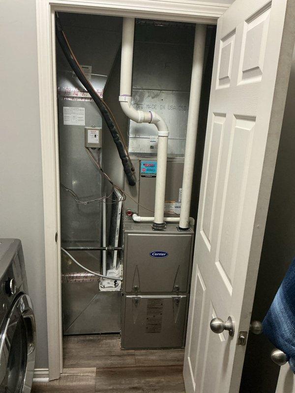 # HVAC Service Completed

Responded to no-cooling call on 15-year-old residential air conditioning system. Customer reported thermostat was calling for cooling but outdoor condensing unit would not start or run. Upon arrival, performed visual inspection of outdoor Carrier condensing unit and indoor air handler system. 

Verified thermostat was properly set to cooling mode and calling for operation. Checked electrical disconnect at outdoor unit and confirmed power supply was available. Tested compressor contactor and found failed contactor preventing compressor and condenser fan motor from receiving power. Replaced defective contactor with OEM-equivalent component rated for system specifications. 

Verified proper voltage at contactor coil and through load contacts. Cycled system multiple times to confirm compressor startup and condenser fan operation. Checked refrigerant pressures and confirmed system operating within normal parameters. Tested amp draw on compressor and fan motor - bot