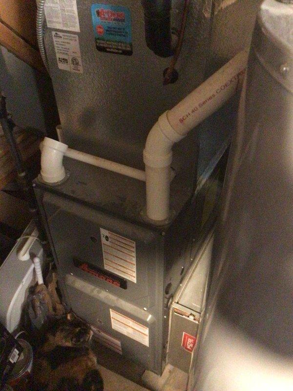 Completed second annual maintenance visit on 8-year-old residential HVAC system with 16x25x5 filter specification. Inspected indoor furnace and air handler unit in basement along with outdoor Amana condensing unit, verified proper operation of all components, and documented system condition with photographs per planned maintenance protocol.