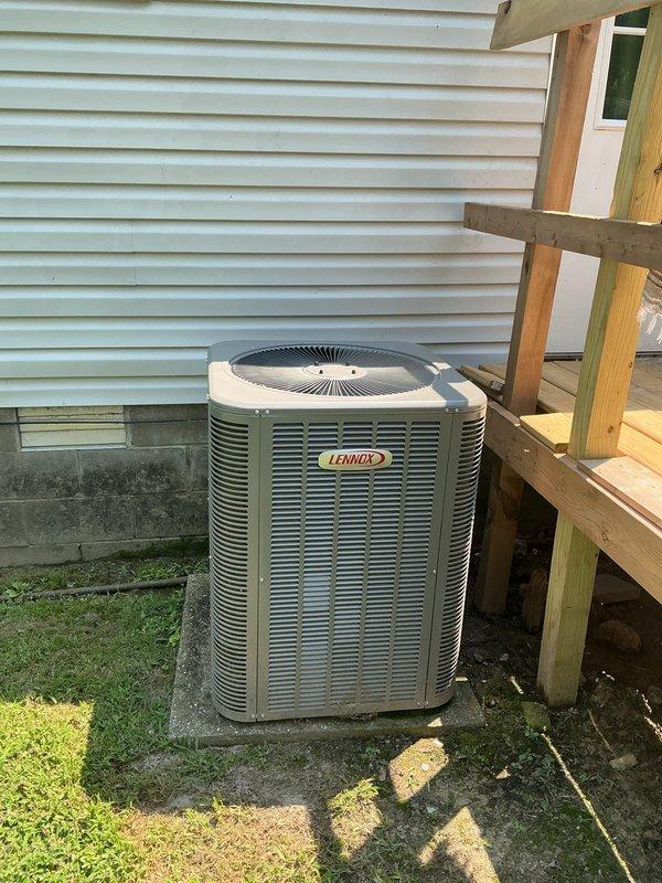 Completed planned monthly maintenance on one-year-old HVAC system in response to customer concern regarding excessive outdoor unit noise. Performed comprehensive inspection of Lennox outdoor condenser unit and indoor air handler components. Checked all electrical connections, refrigerant levels, and mechanical components for proper operation. Inspected blower motor assembly, control board, and wiring harness within air handler compartment. Verified airflow through condenser coil louvers and confirmed fan operation. Assessed condenser pad condition and noted moss accumulation on concrete surface. Replaced CFI filter per maintenance schedule. System operating within normal parameters upon completion of maintenance visit.
