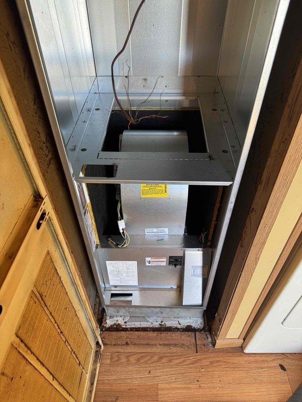 Completed full HVAC system installation including air handler unit mounted in interior utility closet with proper clearances and ventilation. Installed copper refrigerant lines with foam insulation and PVC condensate drainage components, routing exterior connections through foundation with appropriate weatherproofing and support. System commissioned and verified operational per manufacturer specifications.