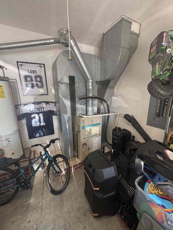 Completed comprehensive HVAC system replacement estimate for residential property. Evaluated existing furnace and ductwork configuration in basement utility area, assessed electrical panel capacity for new equipment installation, and documented current system layout including flexible ductwork routing and existing mechanical equipment placement. Provided homeowner with equipment options and replacement recommendations based on current system assessment.