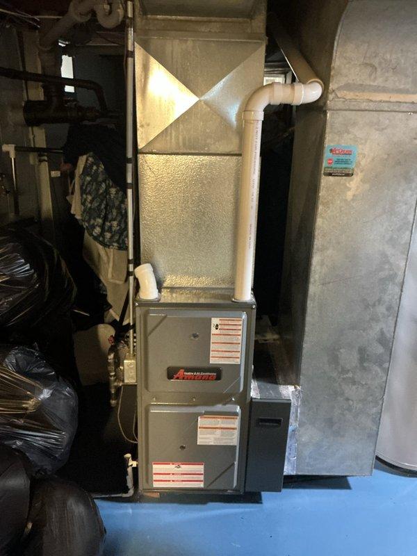 Completed scheduled preventative maintenance on residential split HVAC system including outdoor condensing unit and indoor Amana furnace with air handler. Performed comprehensive AC tune-up inspection with no issues or deficiencies noted. System operating within normal parameters with contract maintenance scheduled through 2026.